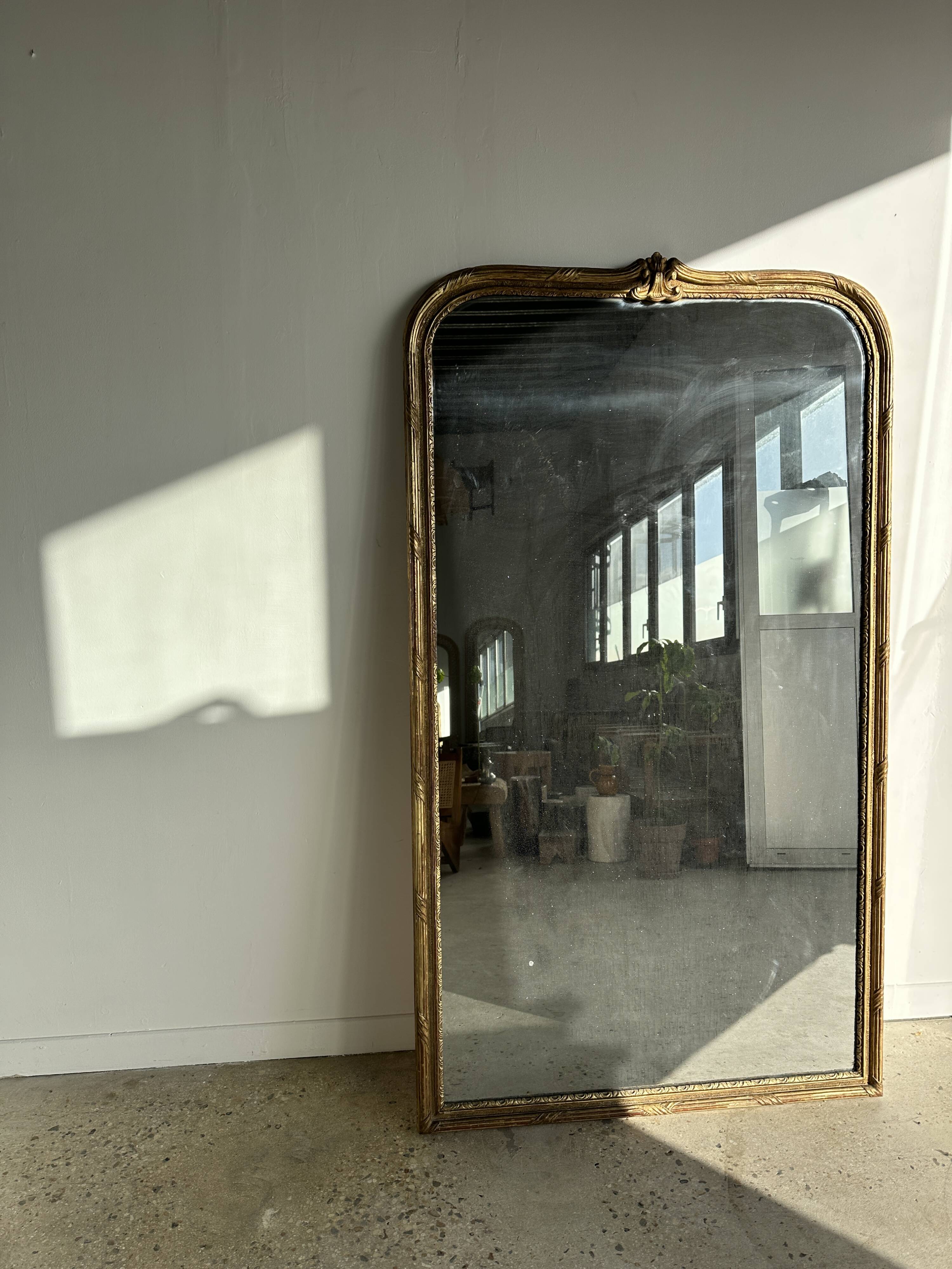 Large gilded mirror 19th century rounded corners mercury glass Louis XVI style