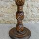 Pedestal table on carved wooden base
