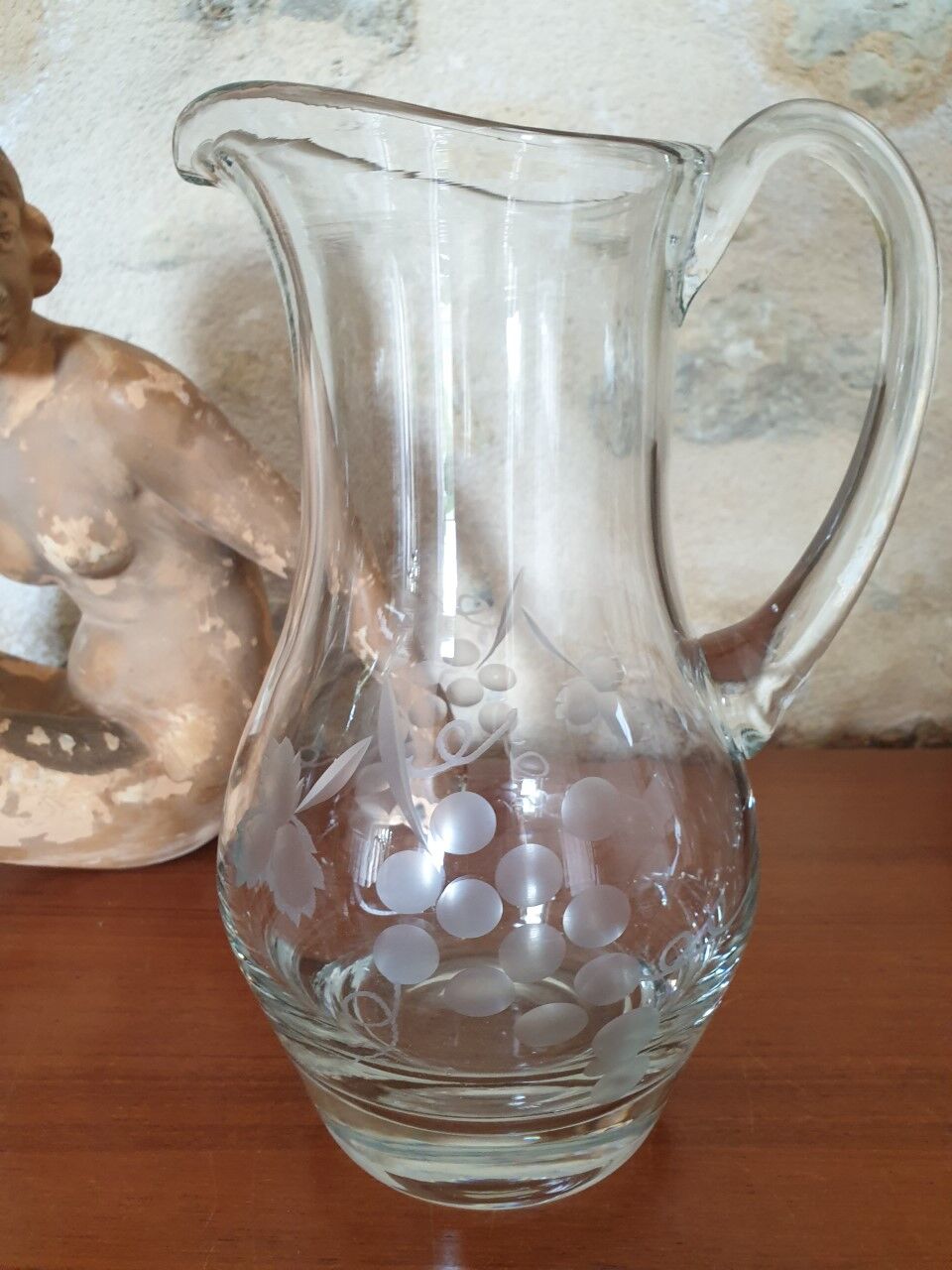 Pitcher decorating grape bunch