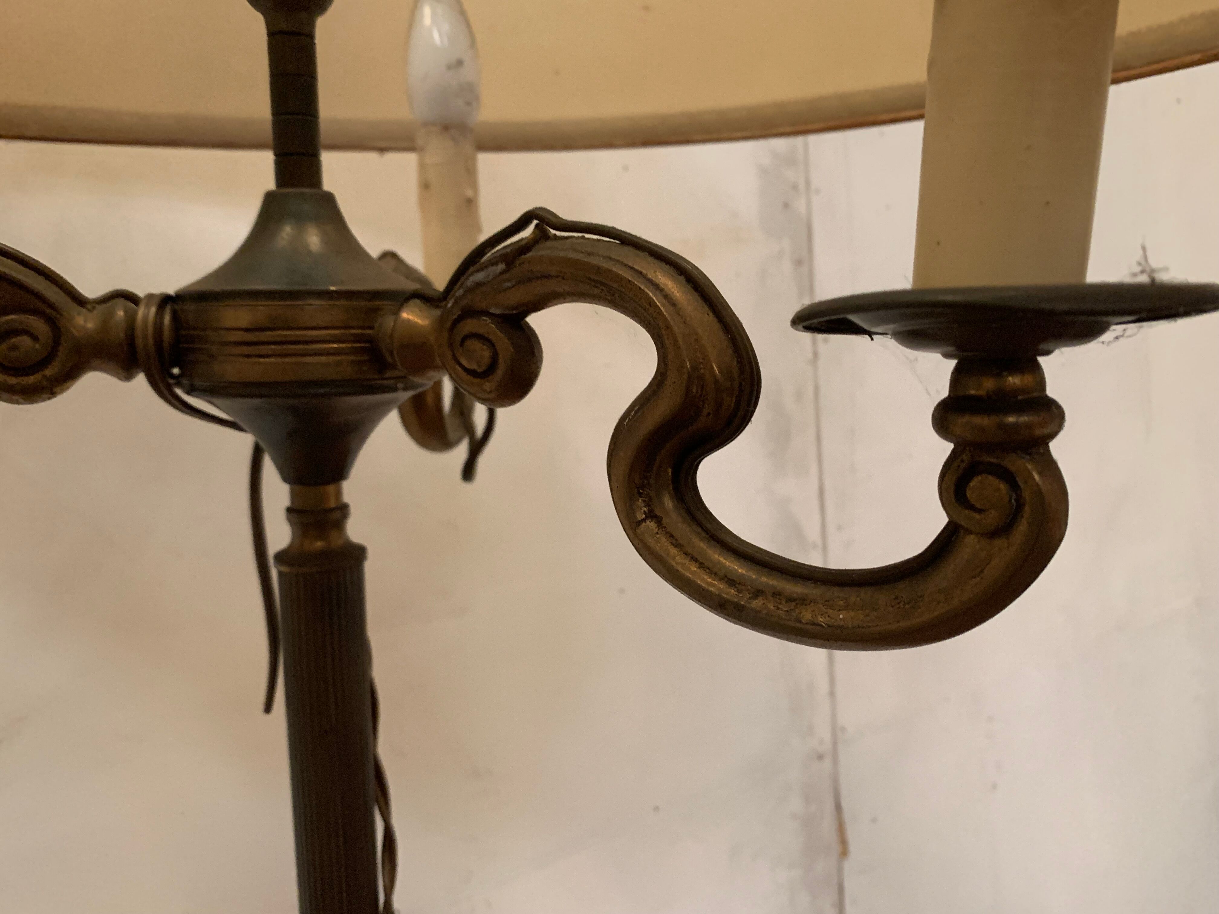 Floor lamp has three brass light arms