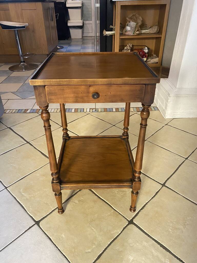Small side table in Louis Philippe style with a patinated wood finish.