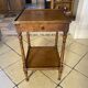 Small side table in Louis Philippe style with a patinated wood finish.