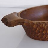 Gouged wooden pocket emptier