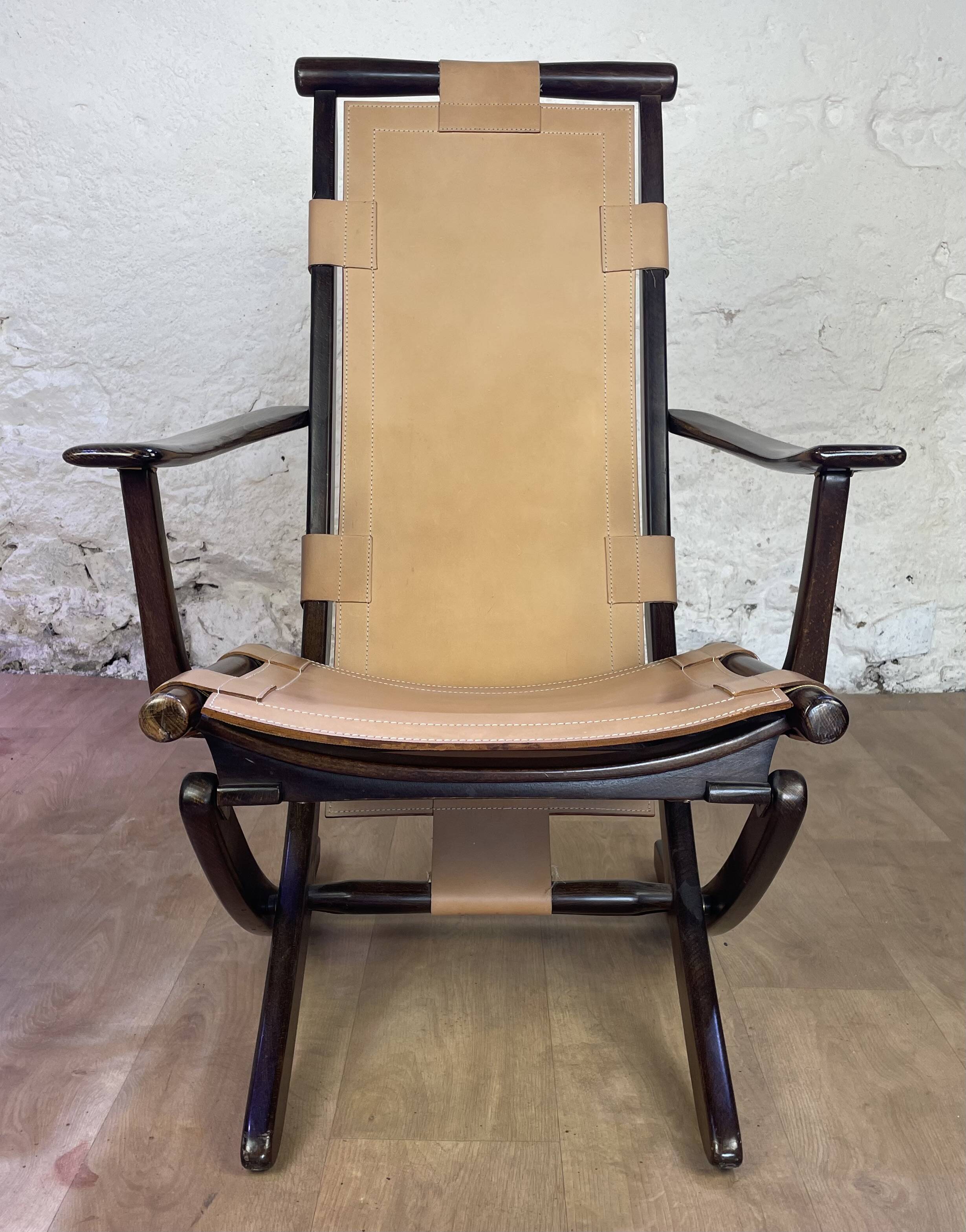 Colonial style leather armchair and ottoman