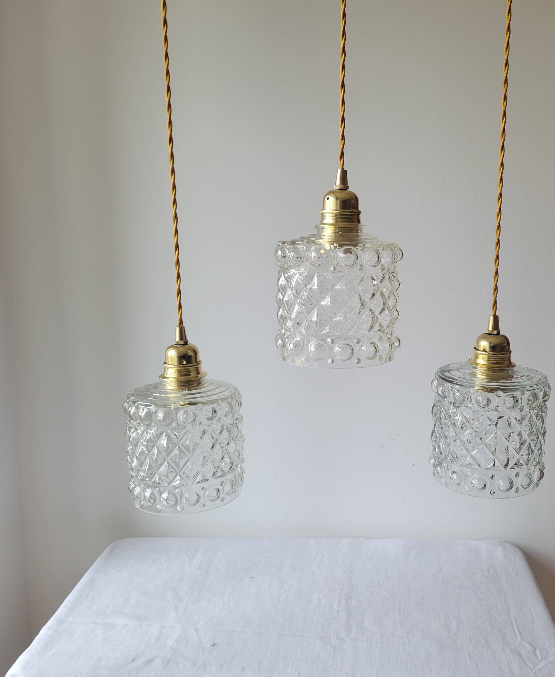 Trio of molded glass pendant lights