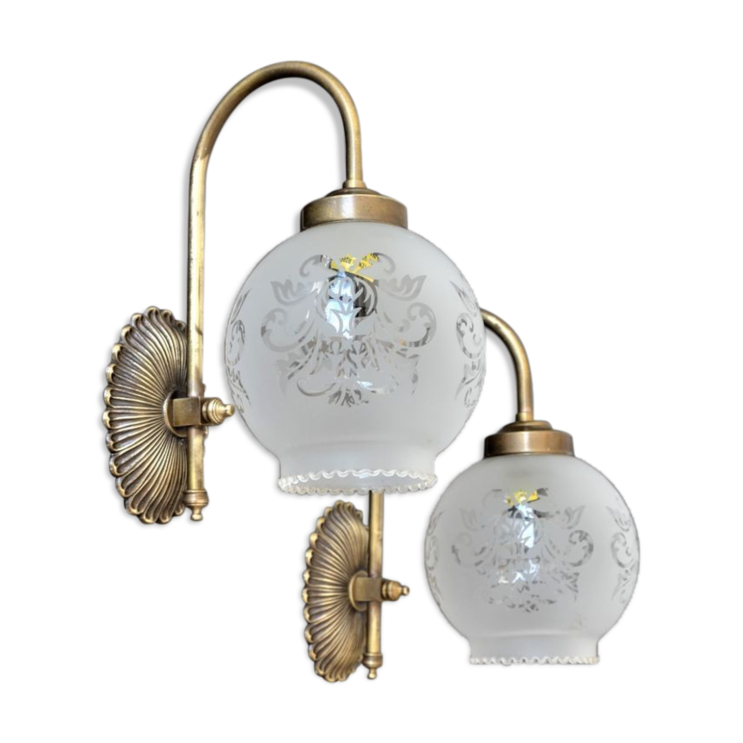 Pair of engraved glass wall lamps, brass support
