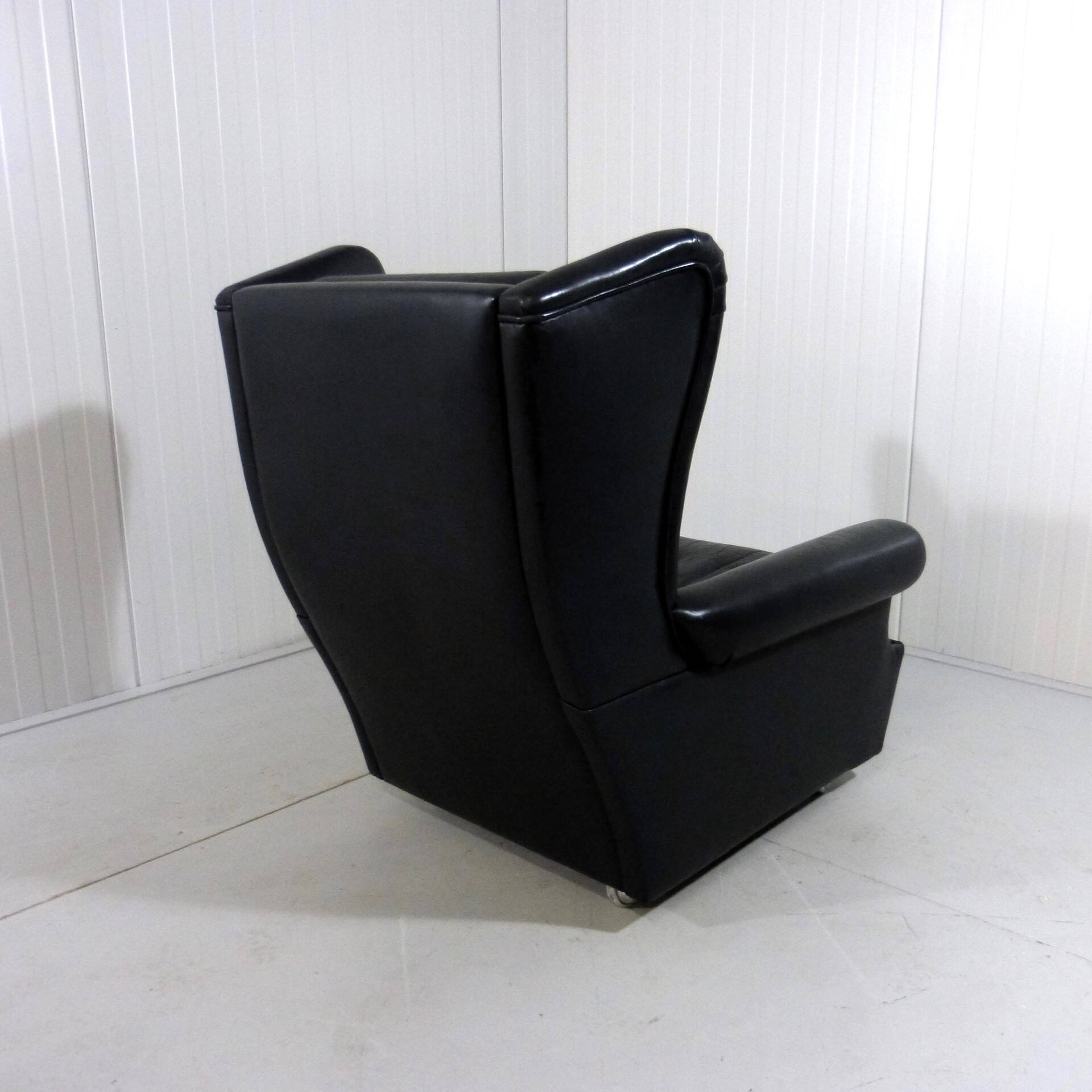 Black leather wingback chair on wheels 1960’s
