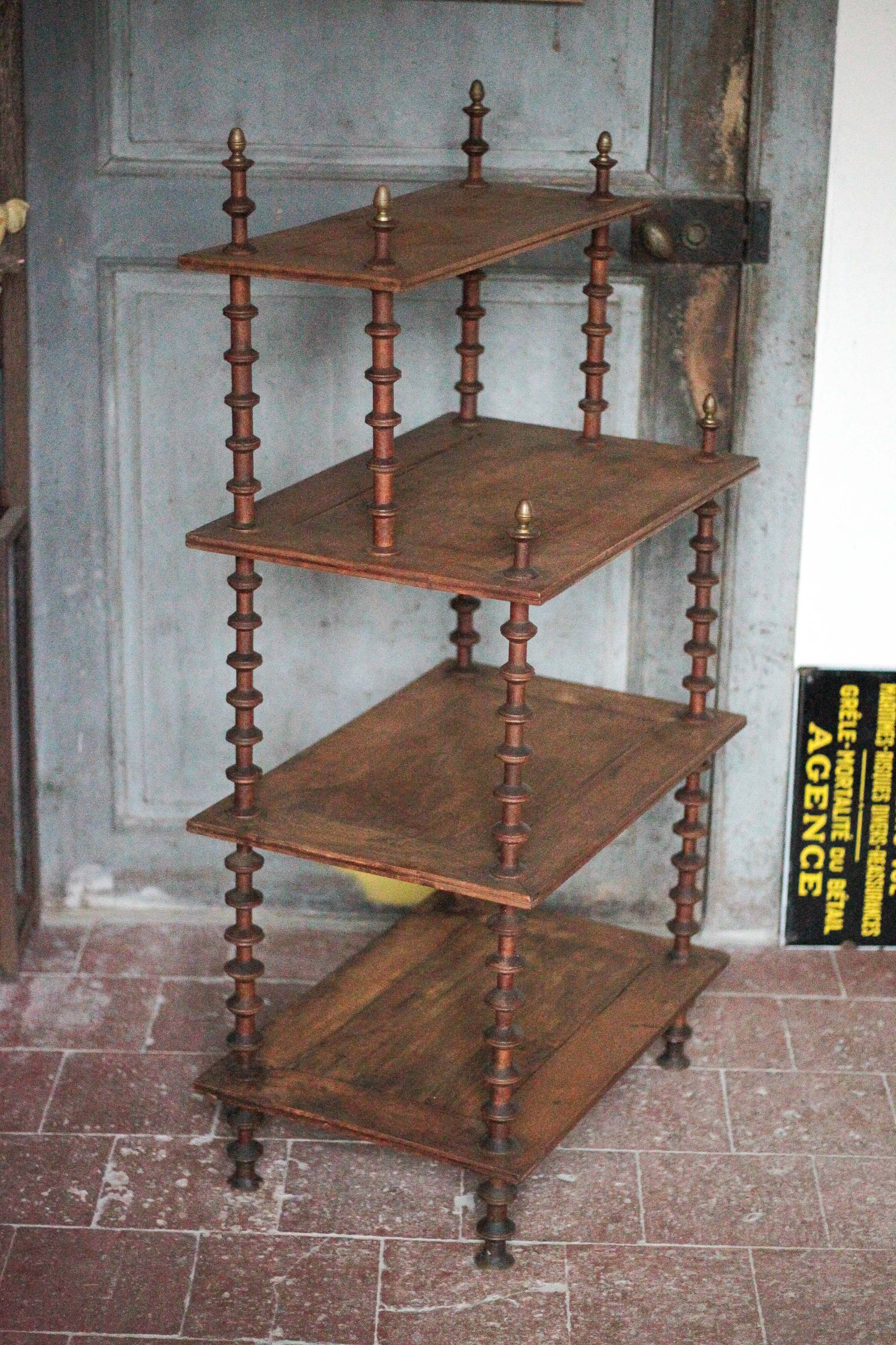 Napoleon III spool shelf, floor-standing shelf with brass tips.