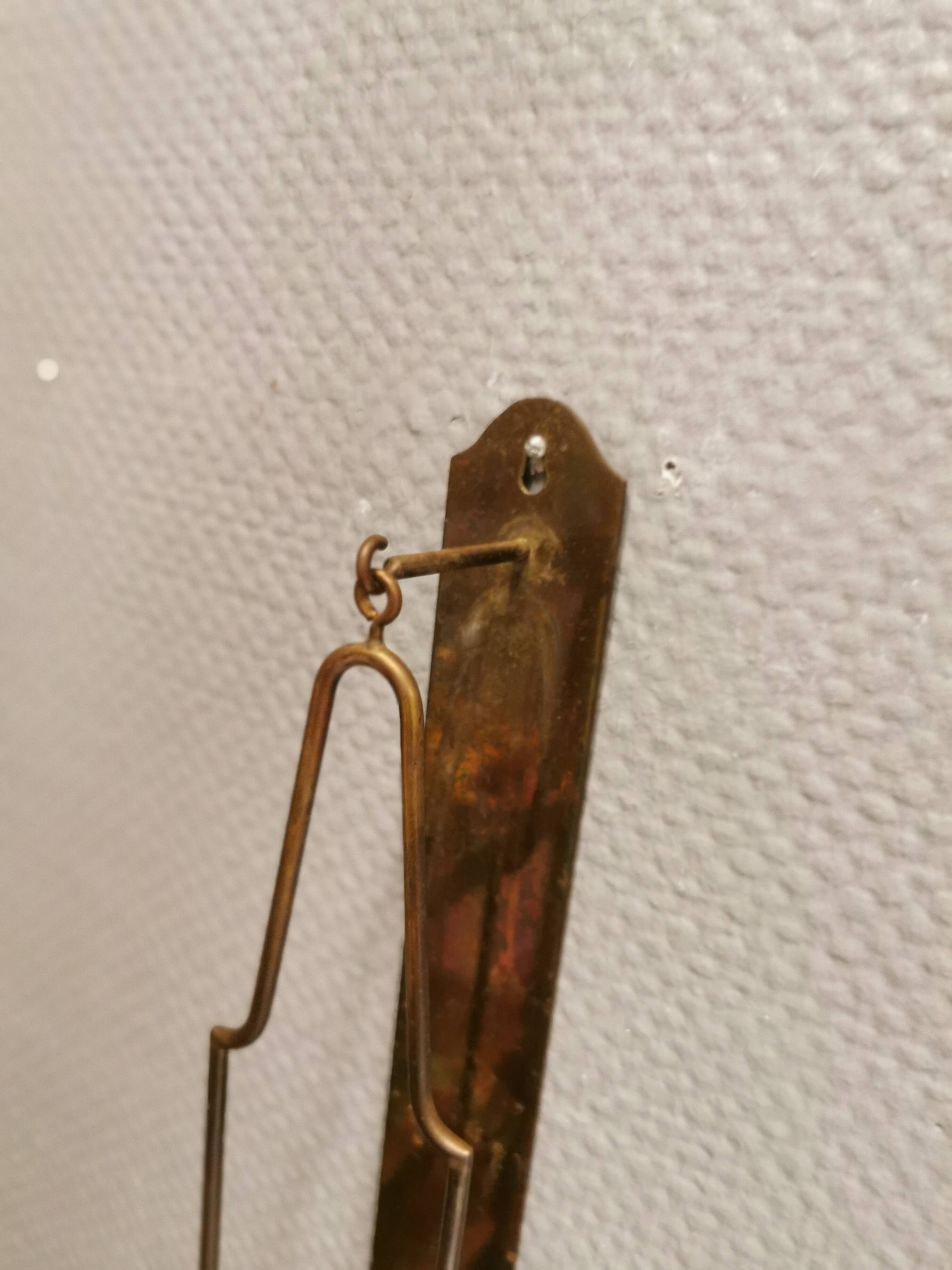 Old Wall hung brass candle holder.