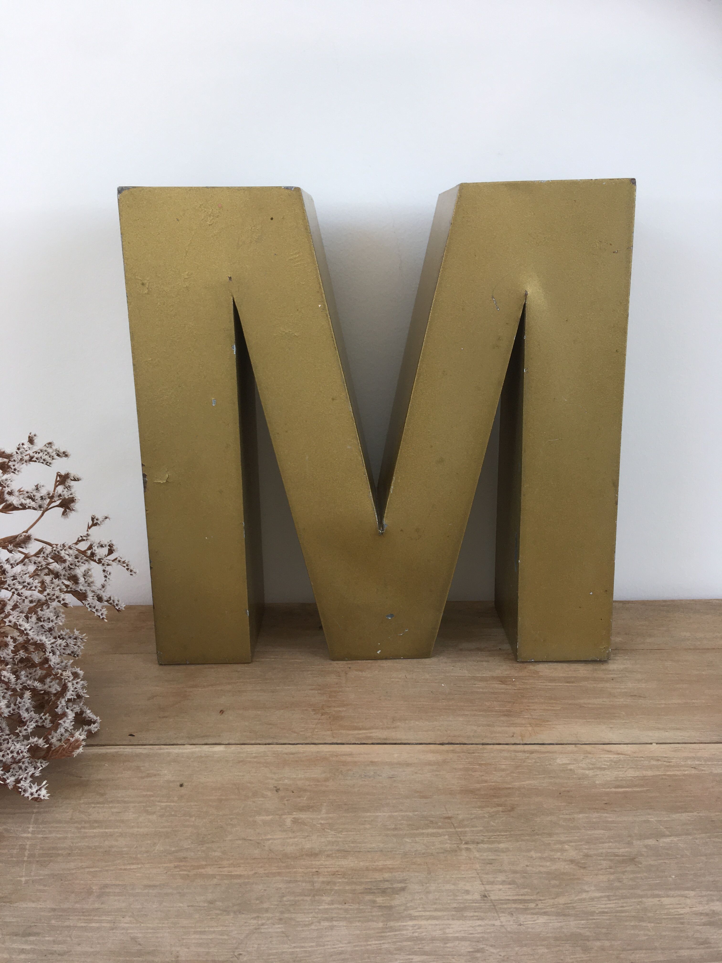 Golden vintage sign letter M