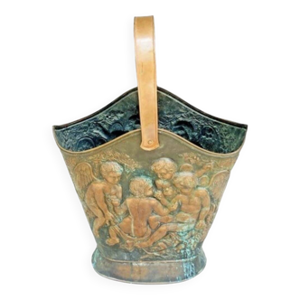 Antique red copper umbrella stand decorated with putti angels.