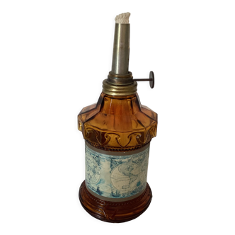 Oil lamp in amber glass, early twentieth century