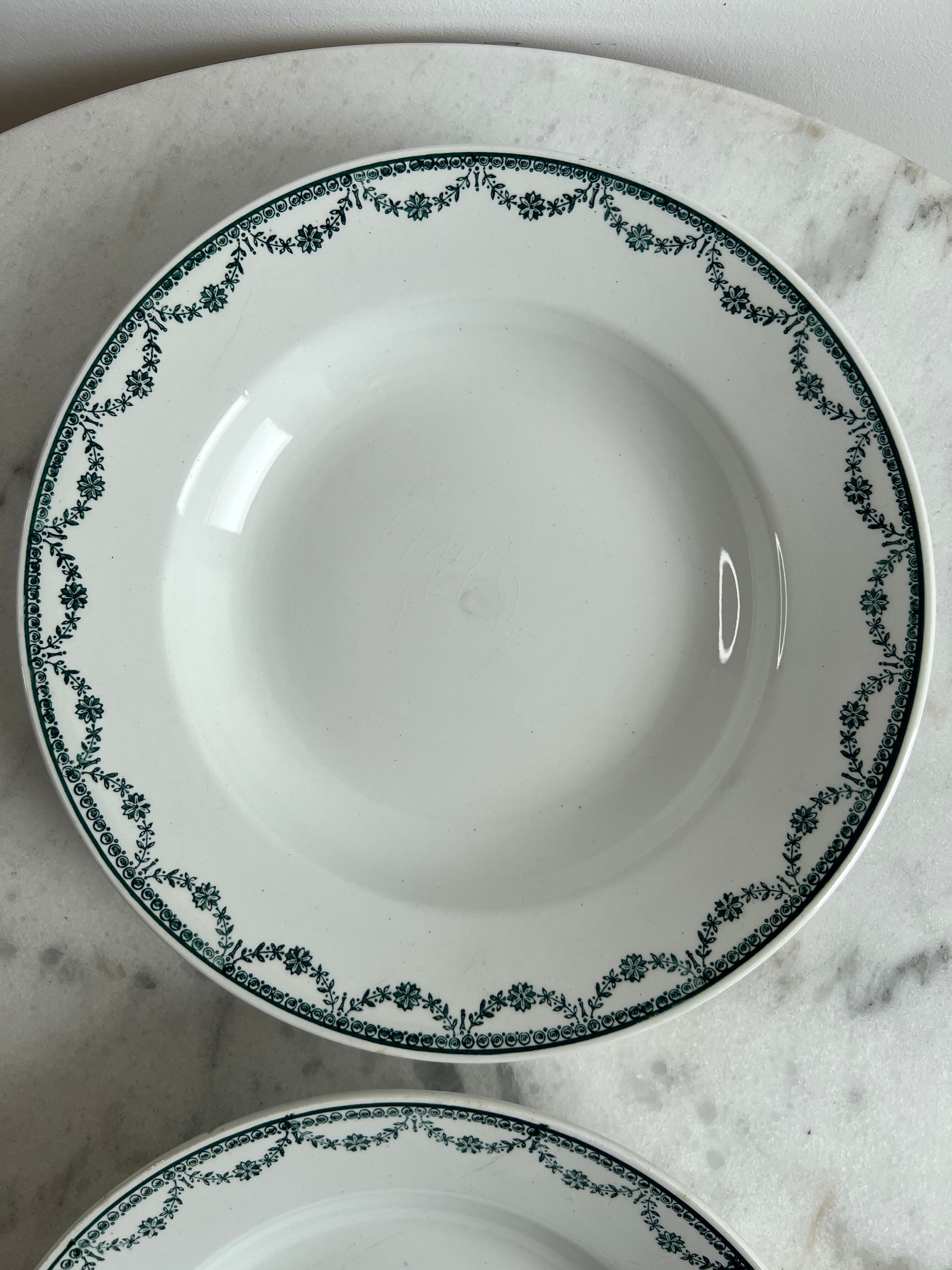 Set of two green frilled deep plates from Saint-Amand.