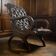 Vintage Chesterfield armchair in dark brown leather / single seat
