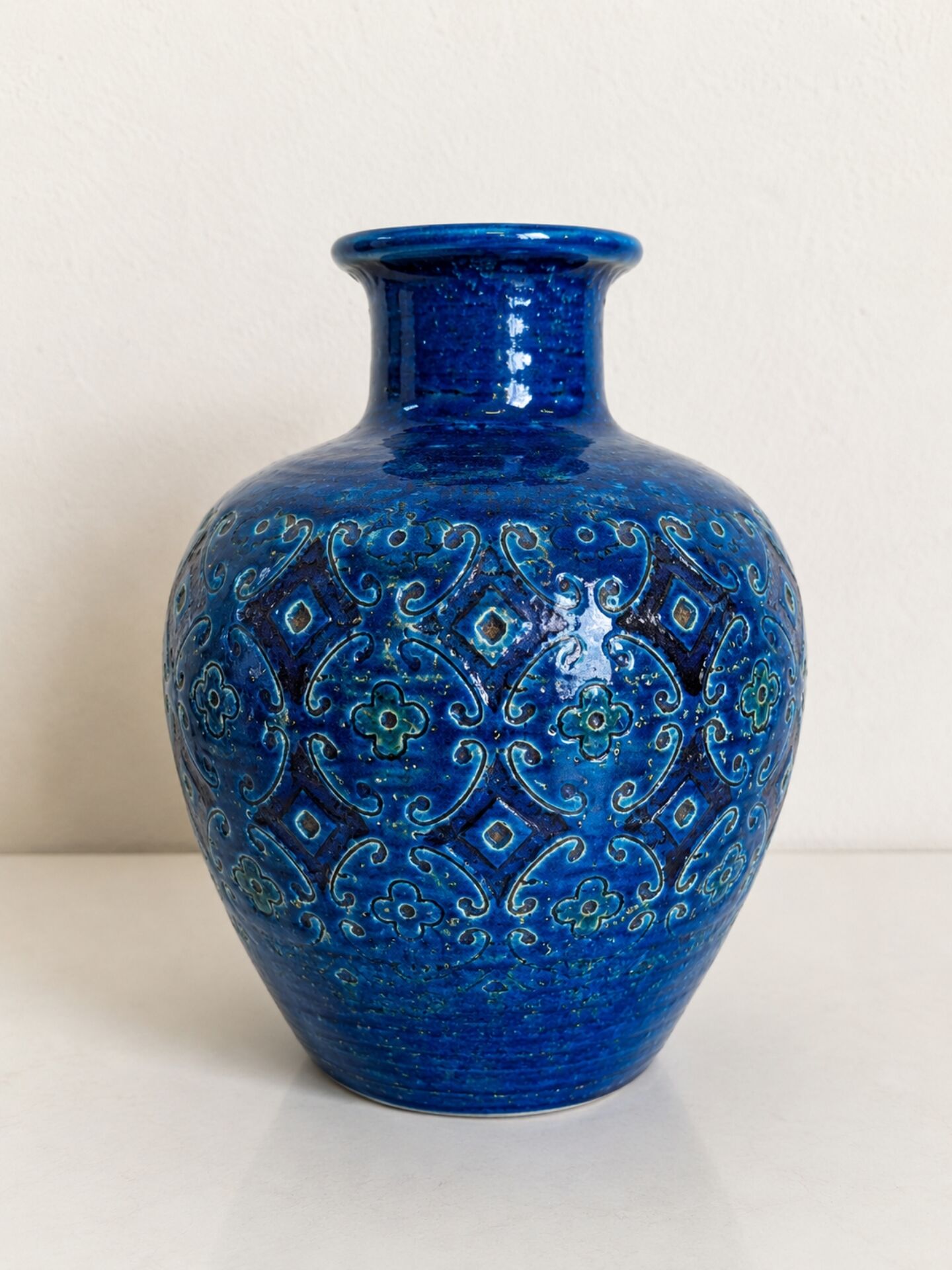 Vintage Italian vase in blue glazed ceramic, relief decoration.