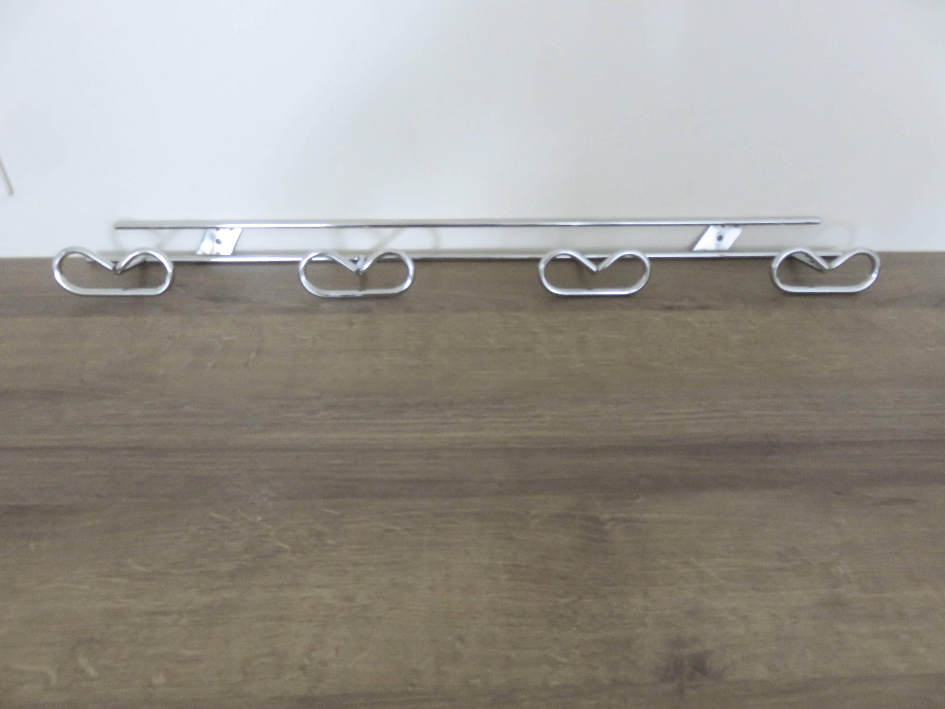 Large vintage wall-mounted coat rack in chrome metal