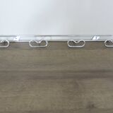 Large vintage wall-mounted coat rack in chrome metal