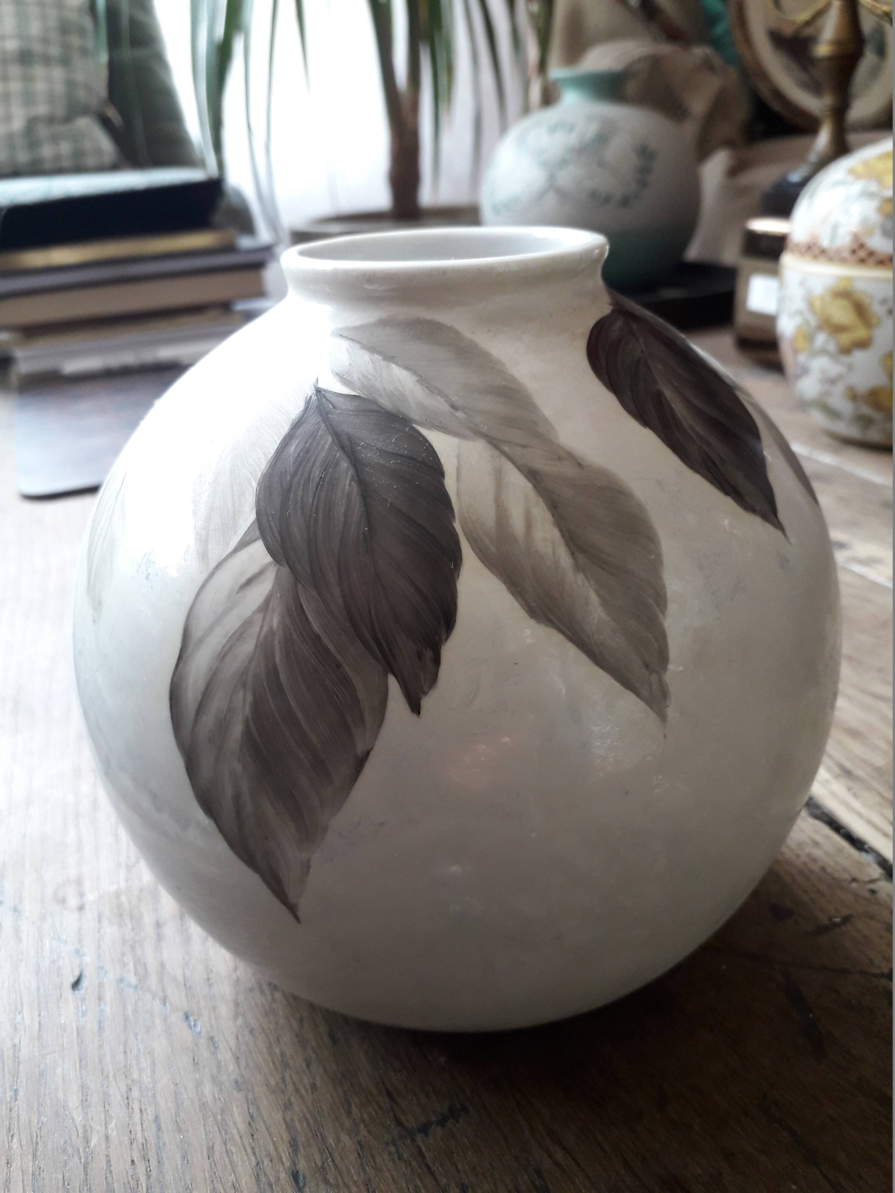 Vintage signed vase with plant decoration