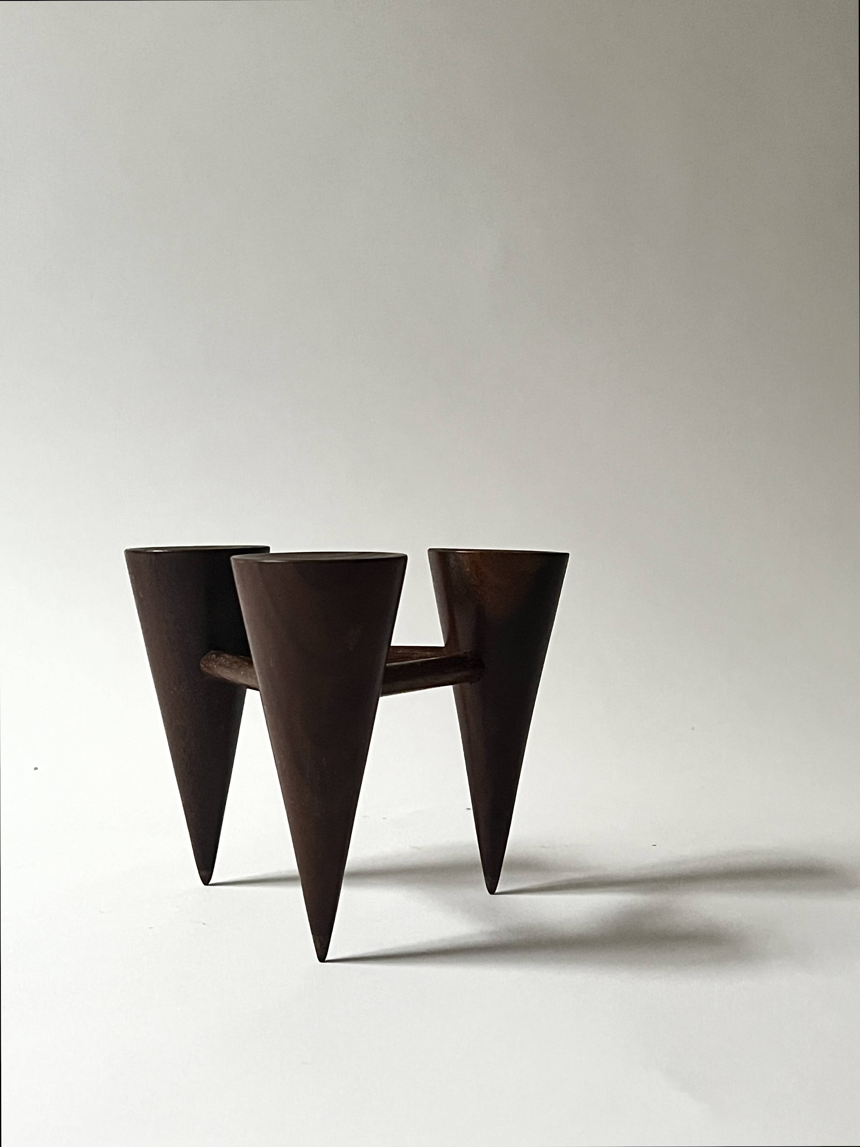 Scandinavian tripod candle holder in carved wood, design from around 1970.