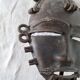 African bronze mask on pedestal, from Ivory Coast, dating