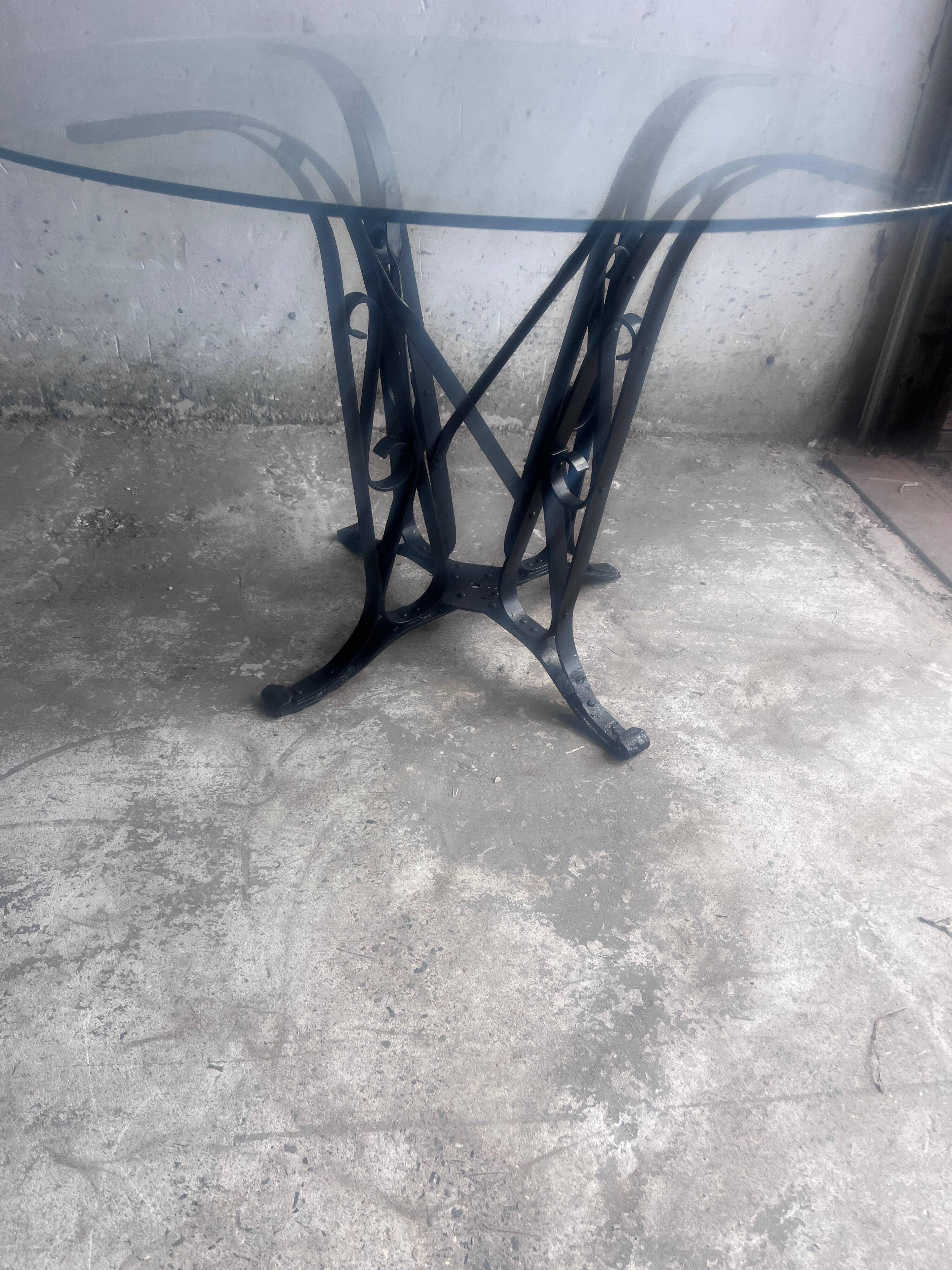 French Art Deco dining table in wrought iron and glass, circa 1930.