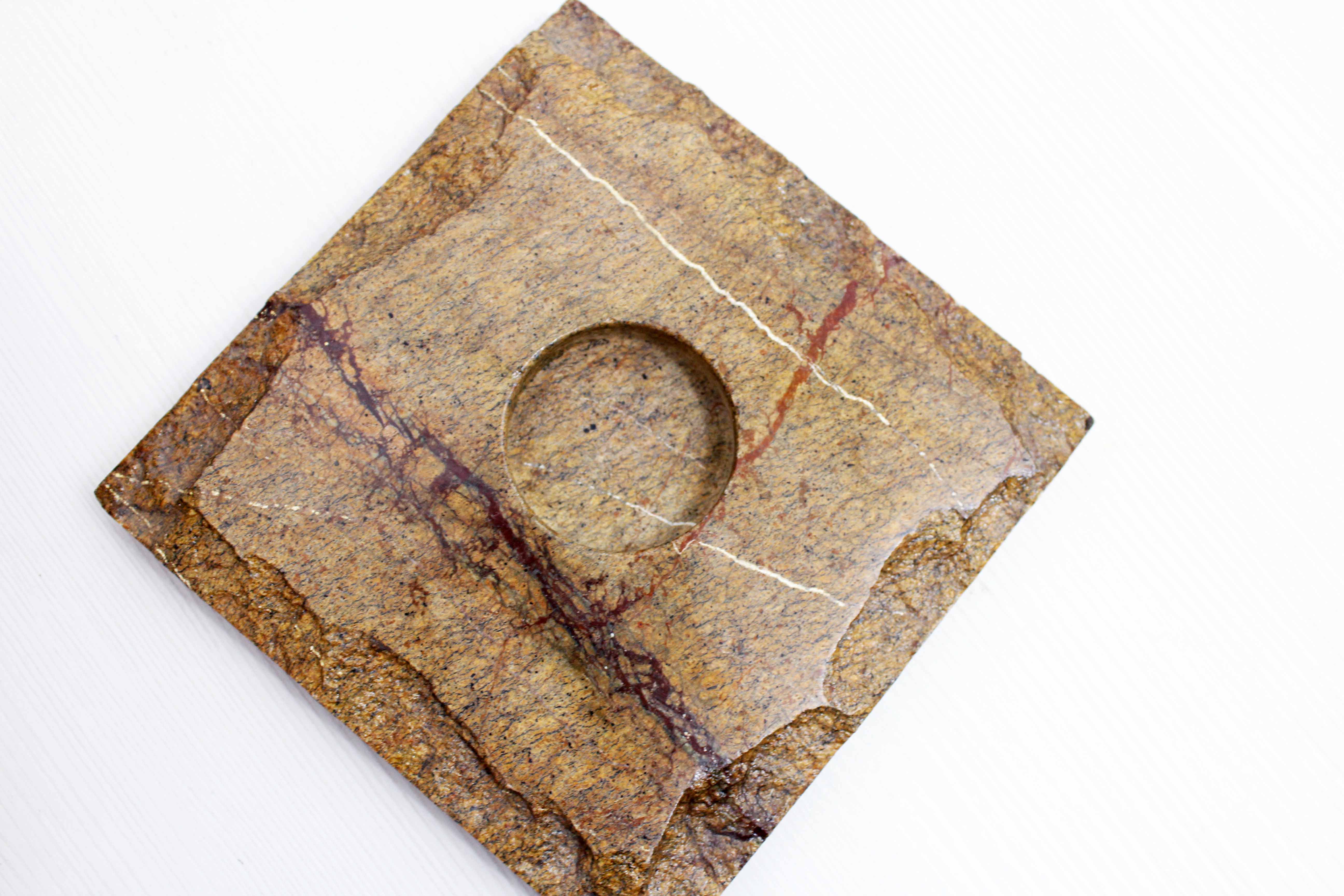 Pair of brutalist travertine candle holders