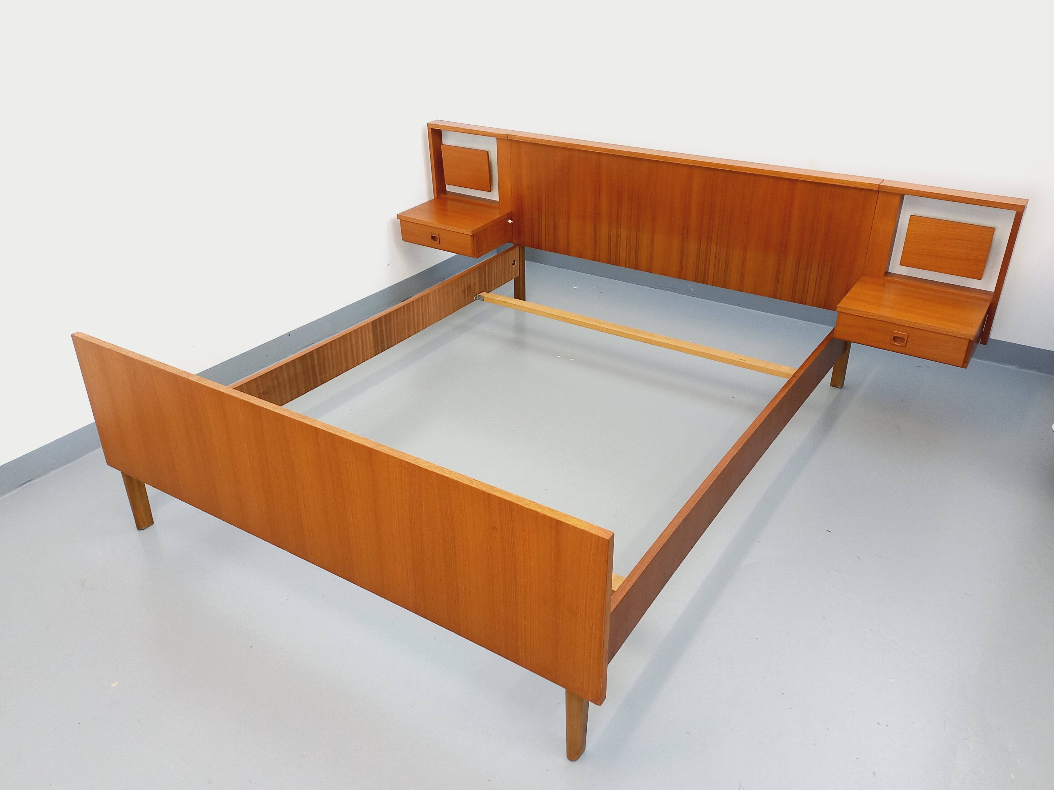 Vintage Scandinavian style double bed in teak from the 60s with integrated bedside lights