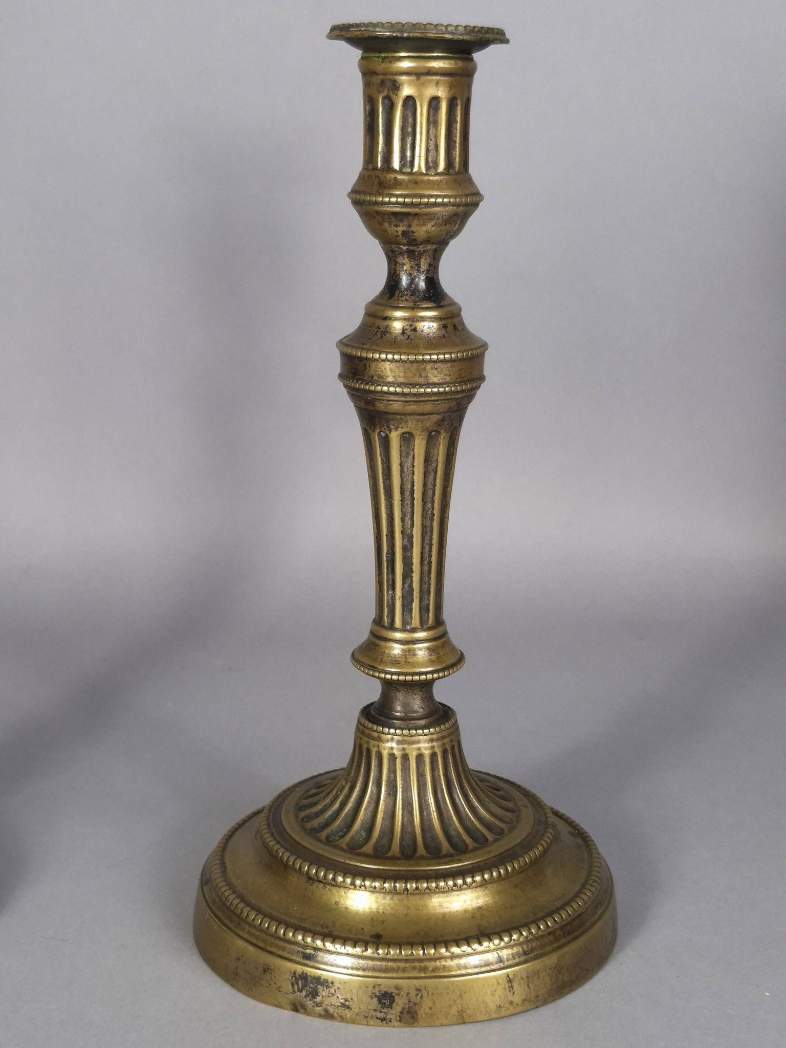 Pair of fluted bronze candlesticks Louis XVI period 27 cm