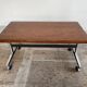 Wooden side table with chrome frame on wheels