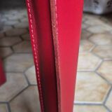 Red leather dining chairs by Arper