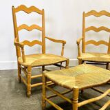 Pair of French Provencal Radassier beech chairs and ottoman, with rush seating.