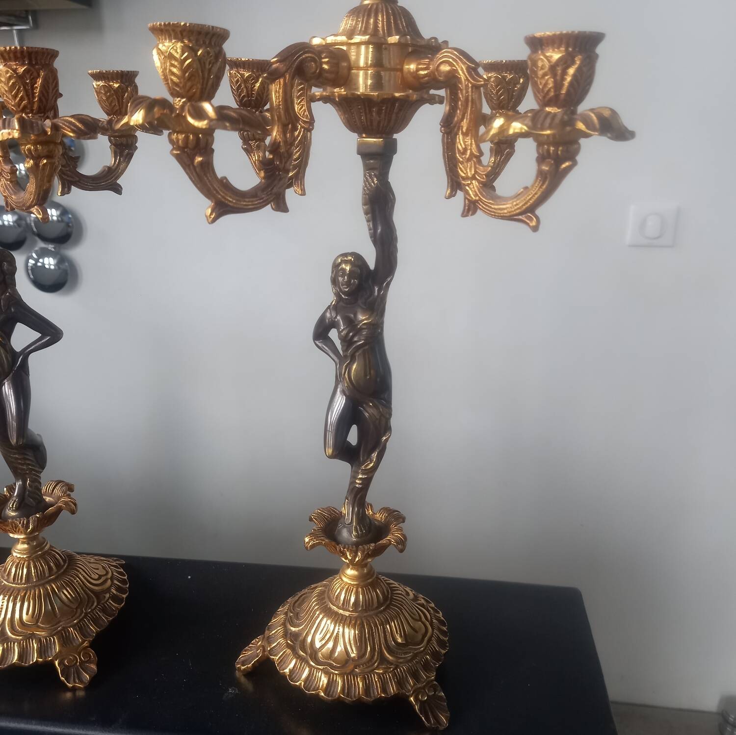 Pair of gilded bronze candlesticks with nude women