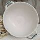 Old mismatched hollow plates in iron earth earthenware accompanied by a soup tureen
