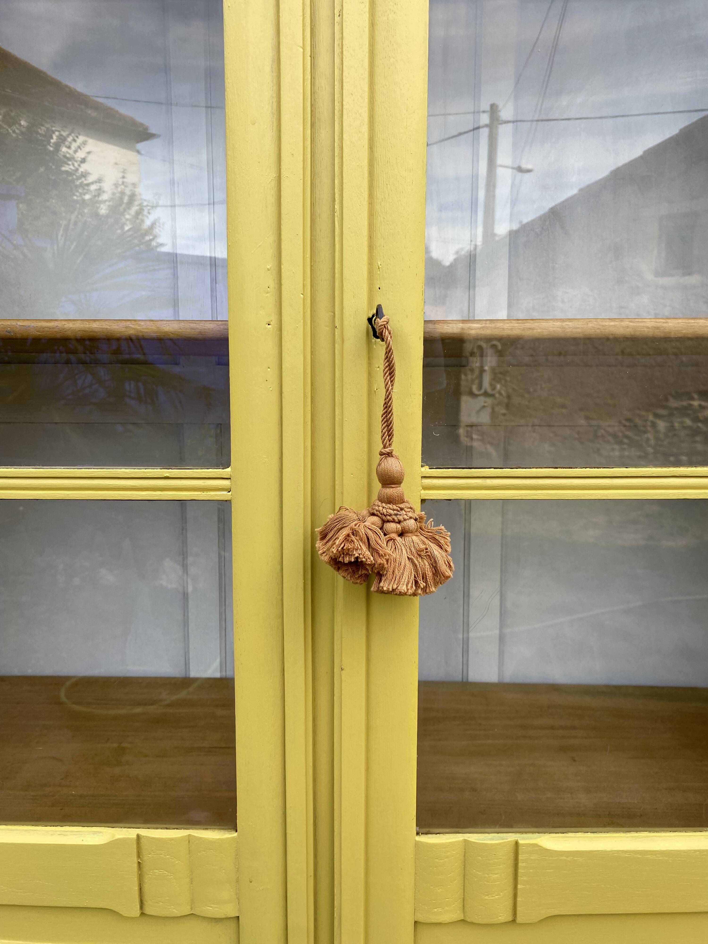 Antique yellow display cabinet