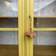 Antique yellow display cabinet