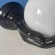 Vintage wall sconce with black hand and white opaline glass globe, 1970s L