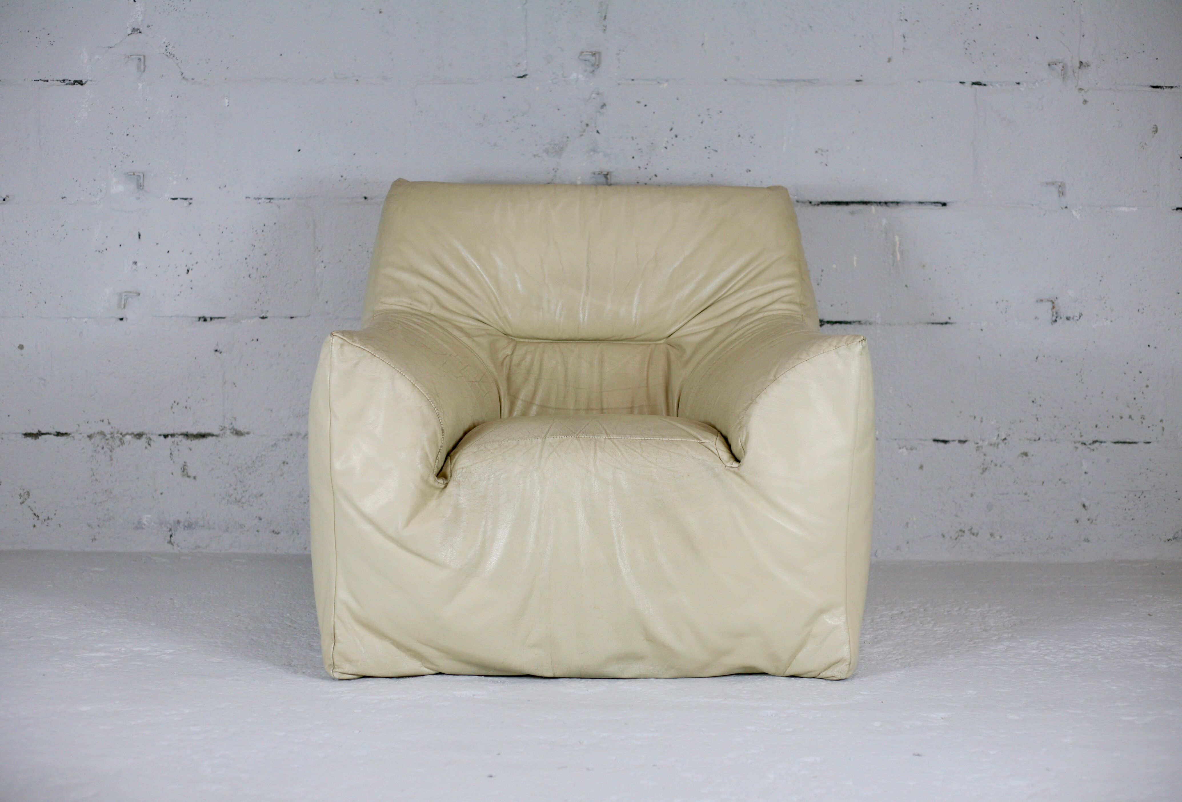 Leather armchair and cream-coloured foam, France , circa 1970