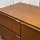 1970s English enfilade in teak with splayed legs.