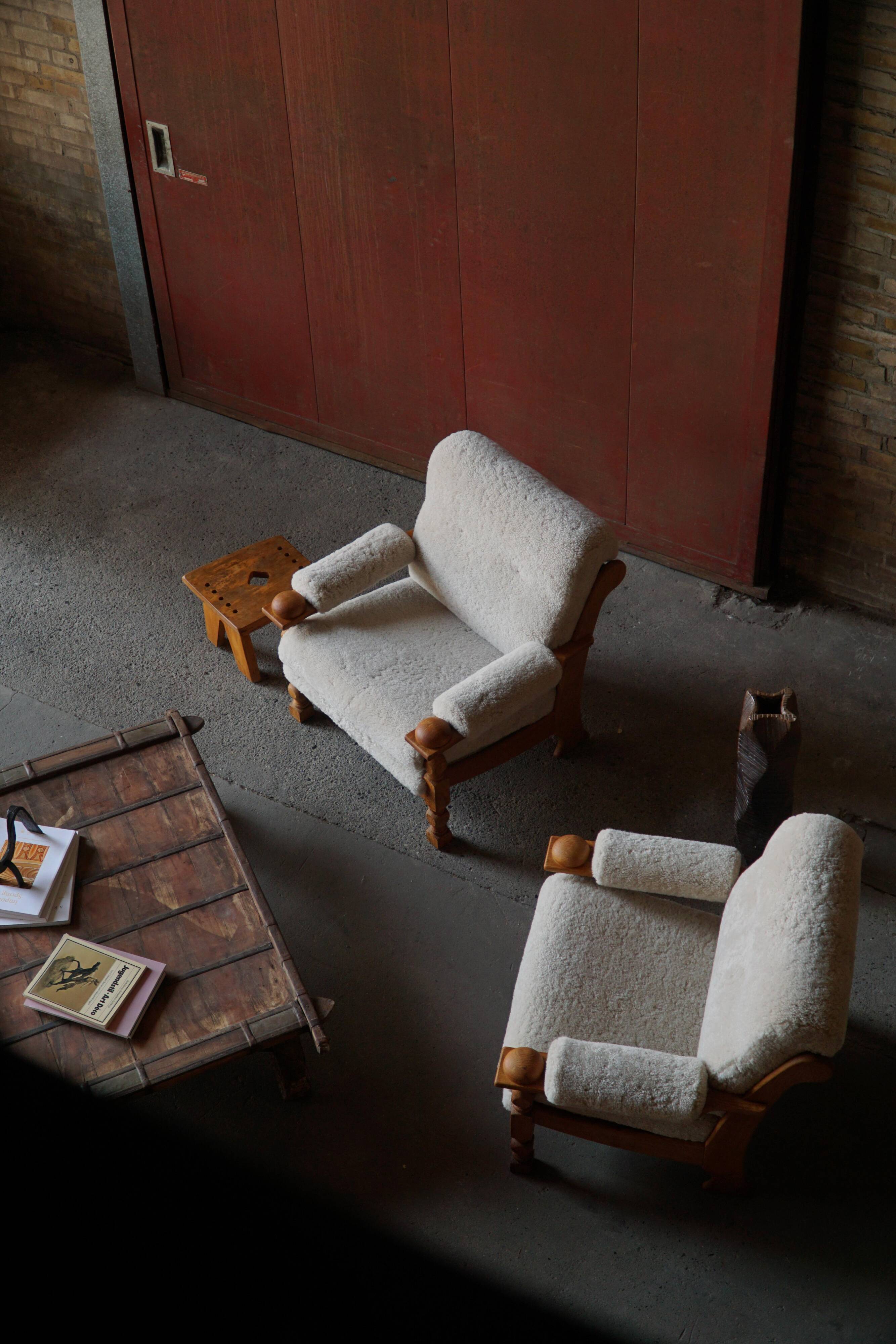 Henning Kjærnulf, lounge chairs in oak and lambswool, mid-century Danish, 1960s.