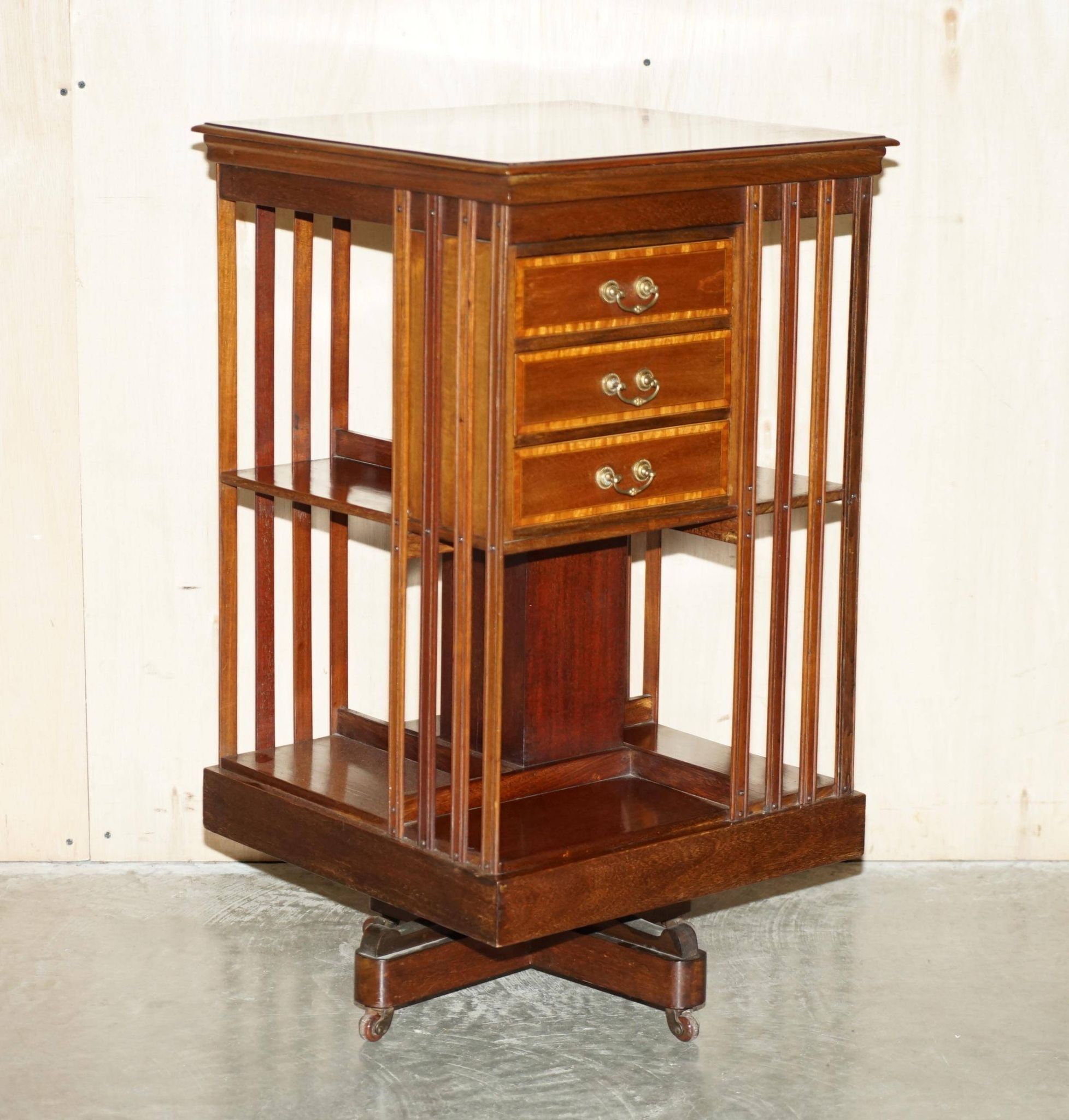 Restored Victorian walnut revolving library.