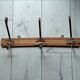 Wooden coat rack with 3 metal hooks