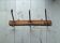 Wooden coat rack with 3 metal hooks