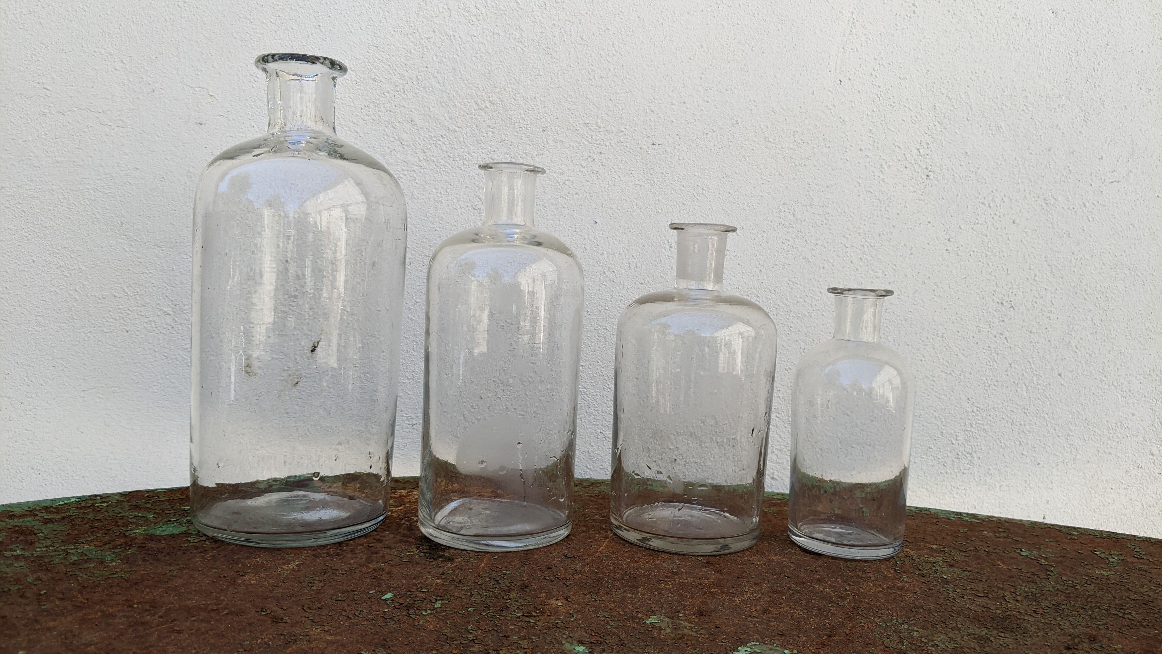 Series of 4 old bottles of herbalist