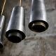Trio of Raak steel pendant lights, 1960s