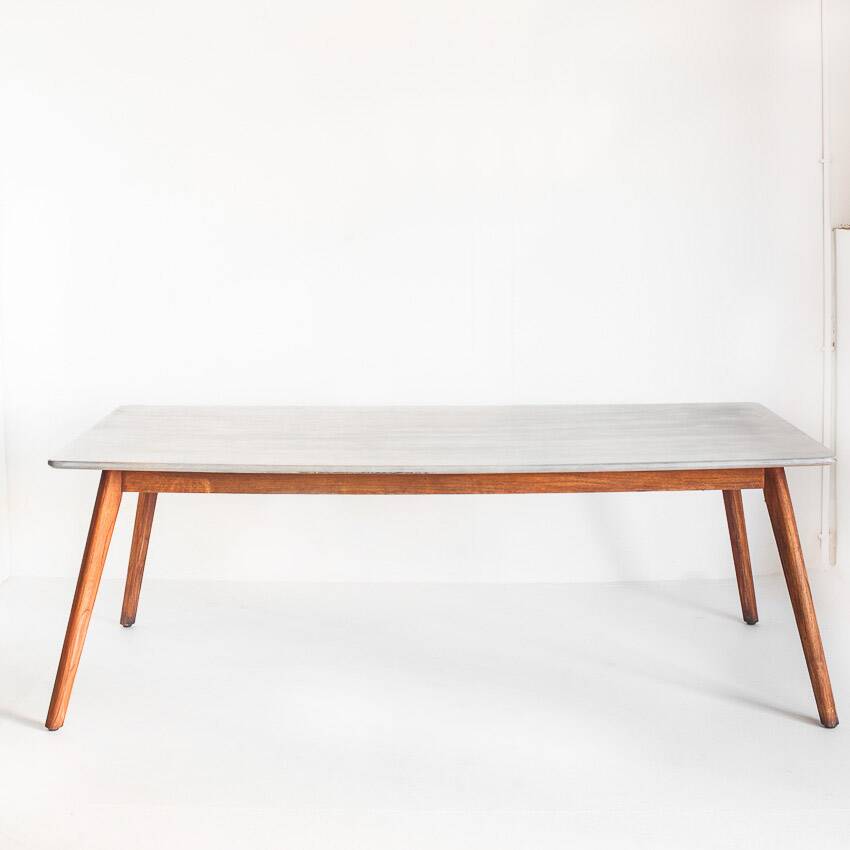 Scandinavian style dining table. Polished and varnished wood and concrete. For indoor or outdoor use.