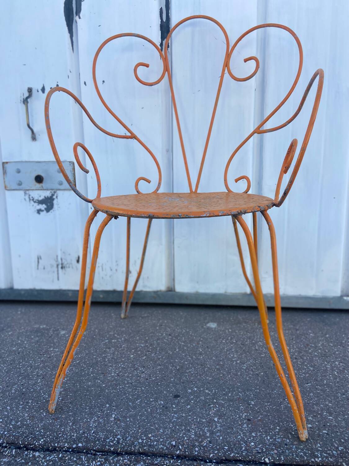Orange wrought iron chair