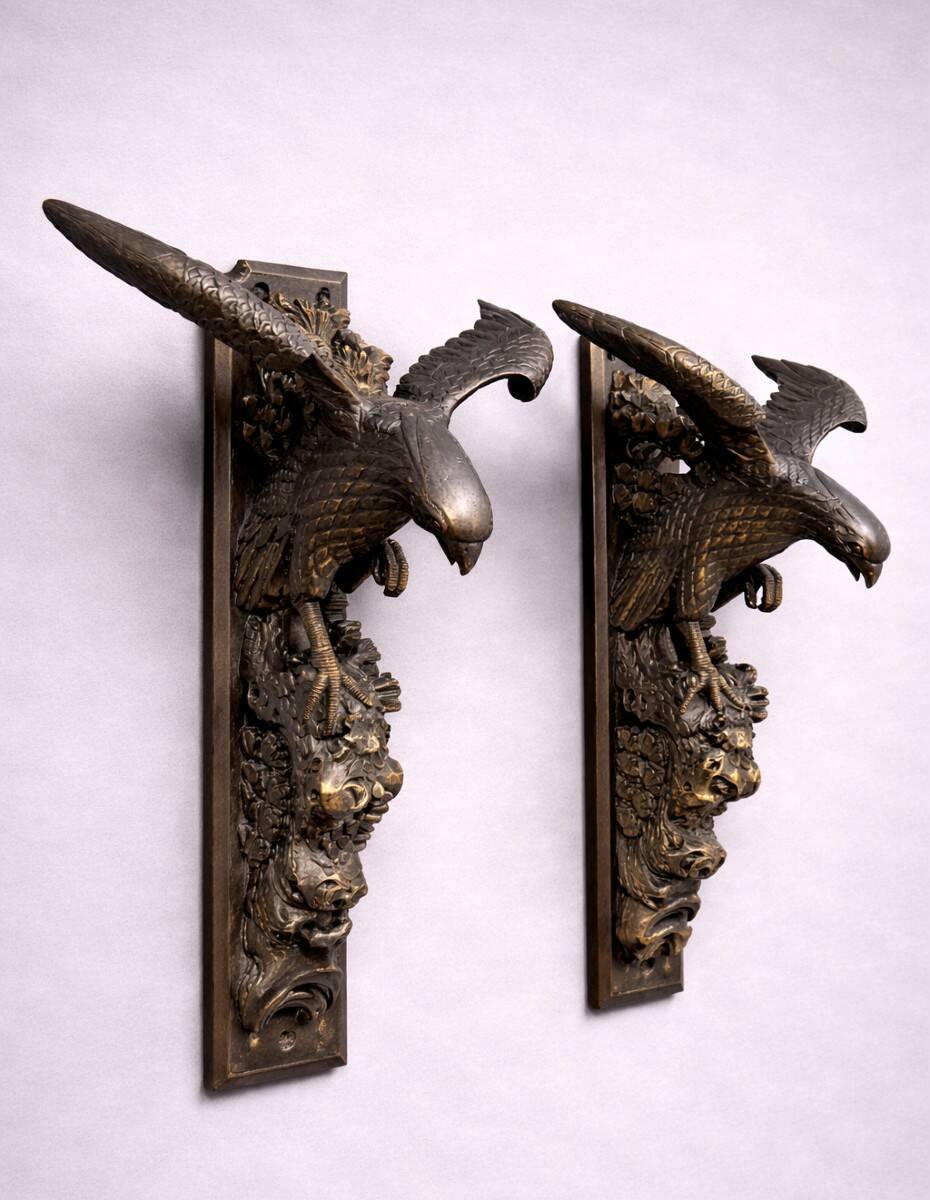 Rare pair of patinated wooden wall consoles, featuring two eagles with outstretched wings.