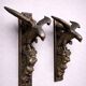 Rare pair of patinated wooden wall consoles, featuring two eagles with outstretched wings.