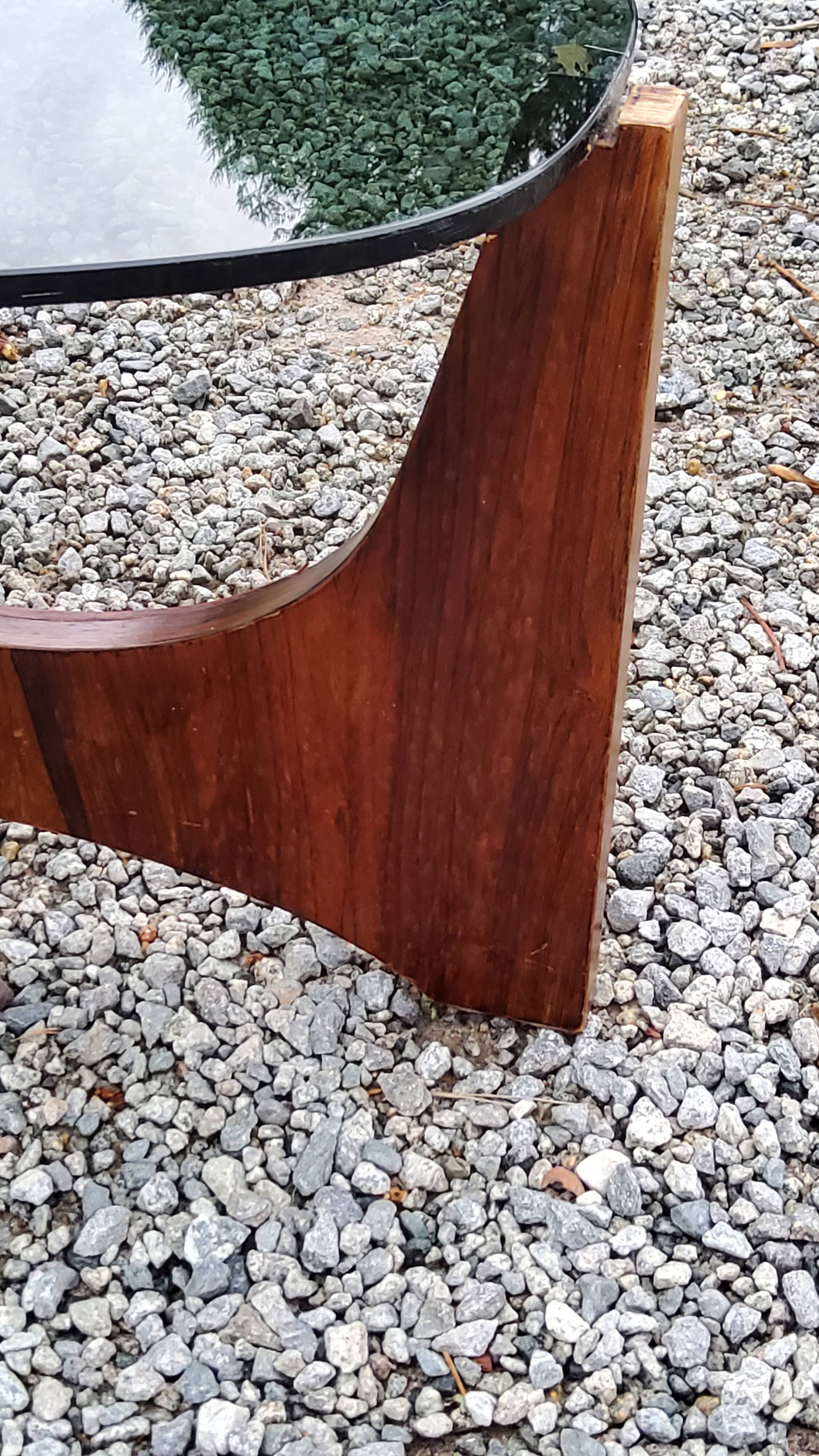 Designer coffee table by Hugues Poignant in rosewood and smoked glass from the 70s