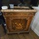 Support furniture in precious wood marquetry, richly decorated with floral marquetry.